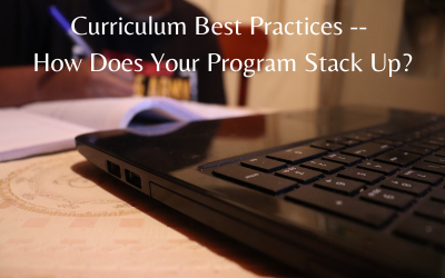 Cropped image of a person writing on a notebook near computer, text reads 'Curriculum Best Practices -- Does Your Program Stack Up?'