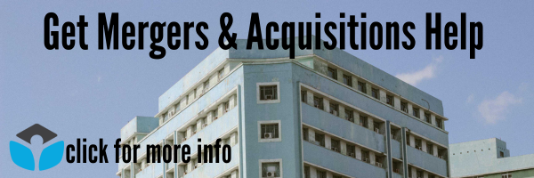 a white concrete building under blue sky. text reads 'Get Mergers & Acquisitions Help. Click for more info'